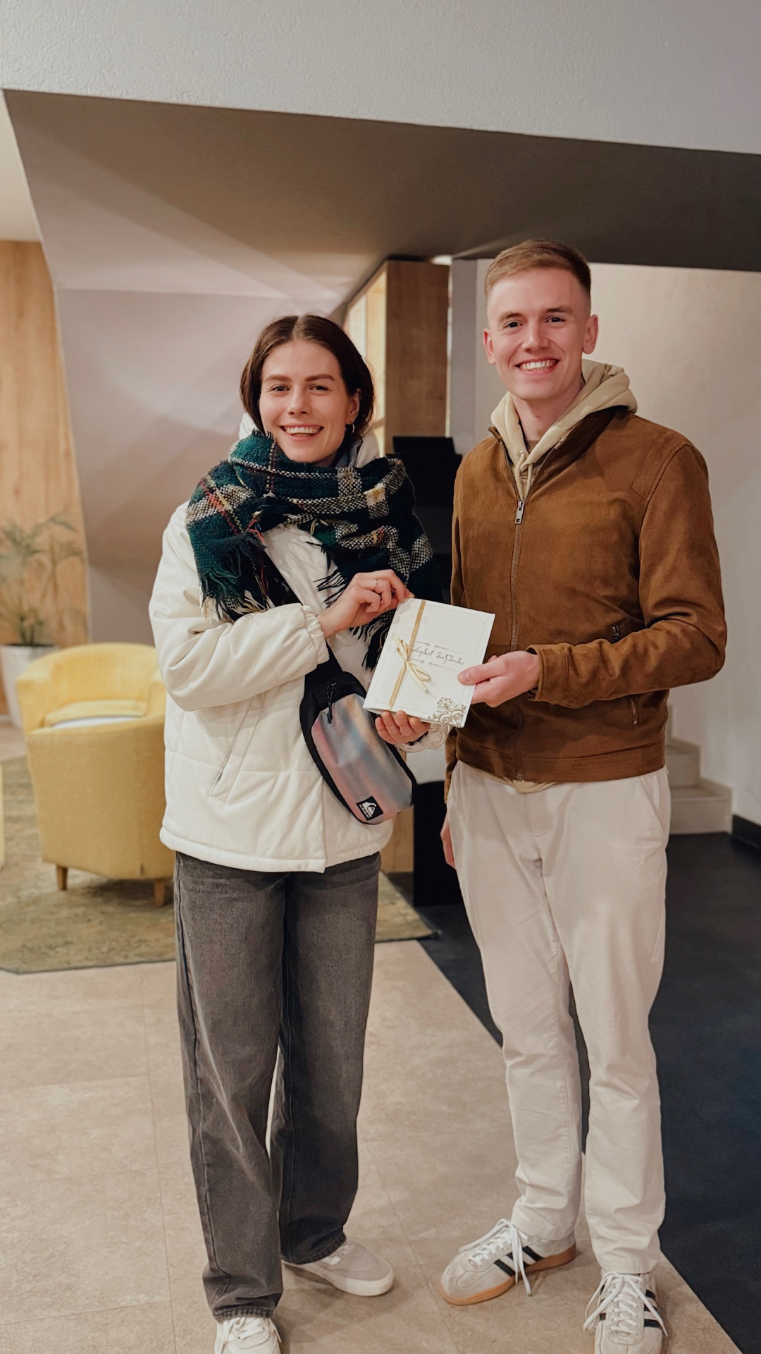 Noel-Raphael and Yana with their marriage certificate